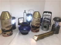 Assortment of flashlights and candle holders.