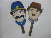 Two Vintage 1970's Cardboard Face Masks On Sticks