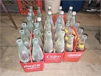 5 packs of coca cola carriers and bottles