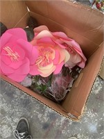 box of paper and artificial flowers