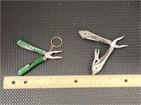 2 Cabela's multi tools. On 1 the scissors does not
