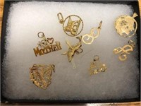 Eight 14kt charms - 7.8g