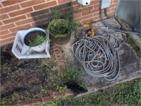 Plastic planters and silver hose