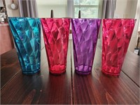 Set of four colorful plastic tumblers 7.5" tall