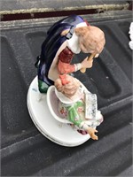 Figurine - it has a chip on her hand