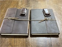 TWO LEATHER BOUND NOTEBOOKS TWO LEATHER CLIPS