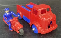 (X) Red Toy Truck And Police Officer On