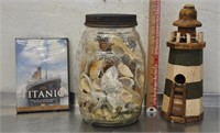 Jar of shells, lighthouse, Titanic DVD, note