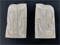 Pair of ivory carvings depicting whales and witche