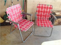 Two matching pink retro folding chairs
