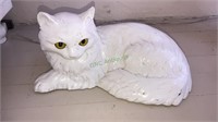 White ceramic cat laying down, about 12 inches
