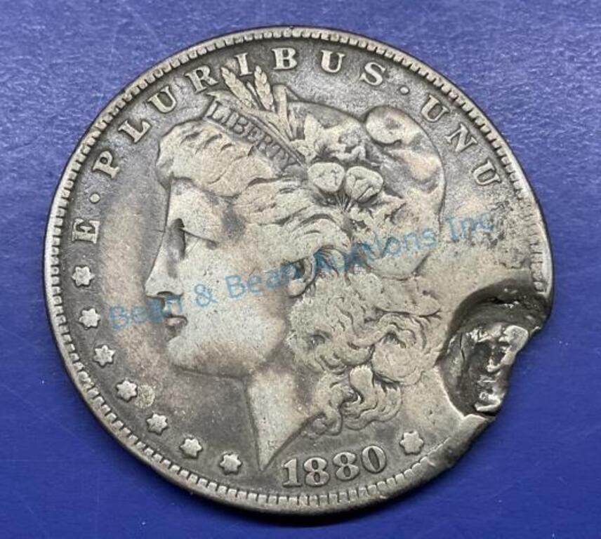 1880 New Orleans, silver dollar with bullet strike