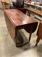 Antique double drop leaf table on wheels