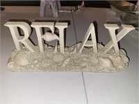 RELAX sign with seashells. Resin