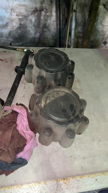 2 ford wheel center caps and grease guns