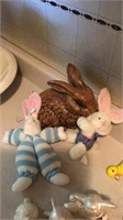 Two stuffed and one glass Easter bunnies