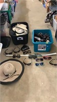 Various sunglasses and sun hats