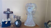 Crucifix, singing nuns, Angel statute, vase and