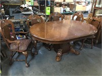 Massive Oak Claw foot dining table, and 10 Chairs