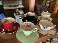 5 cups and saucers, various names