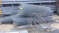 several rolls of chain link fence