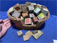 Antique alphabet blocks in cat basket