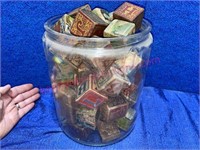 Antique alphabet blocks in large jar (2-gallon)