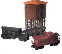 LIONEL WATER TOWER WITH TWO TRAIN CARS