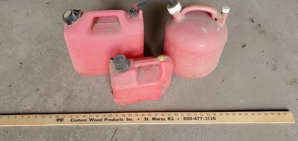 3 Plastic Gas Cans.