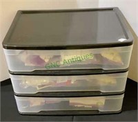 Three drawer storage container filled with