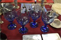 set of blue stemware