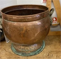 Large copper pot with decorative handles