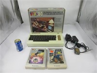 Console Commodore avec accessoires et 2 jeux en