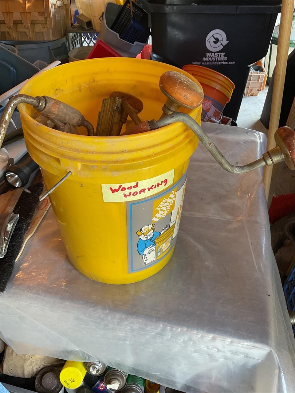 Bucket of woodworking tools and folding rulers