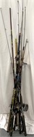 Large lot of fishing poles, some with reels