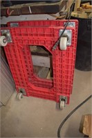 Two Red Plastic Bread Cart Dollies