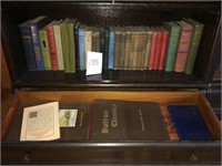 3 shelves and a drawer of antique books