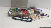 Plastic bin: bracelets, beaded necklaces