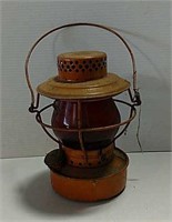 Orange construction lantern with red lens