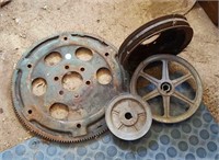 Three metal pulleys and a gear