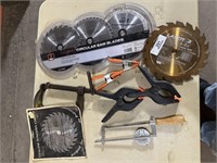 5 misc saw blades and clamps