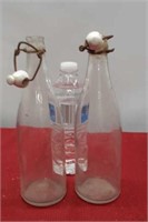Vintage porcelain clip clear glass bottles