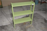 Small green free standing book or display shelf