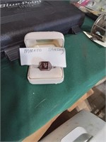 Man's ring in box marked Sterling