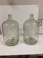 2 glass carboys for wine making.