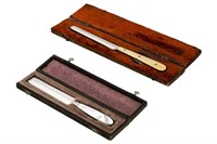 TWO ANTIQUE CASED CIRCUMCISION KNIVES