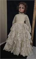 old doll with vintage lace dress