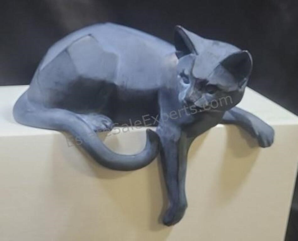Resin sculpture of a cat. 8×7