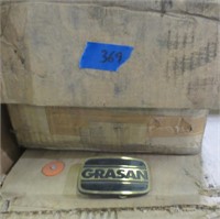 Box of Grasan belt buckles