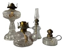 FOUR ANTIQUE OIL LAMPS